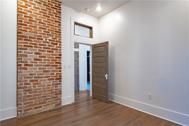 623-25 Louisa St, New Orleans, LA 70117 - spare room featuring baseboards and wood finished floors