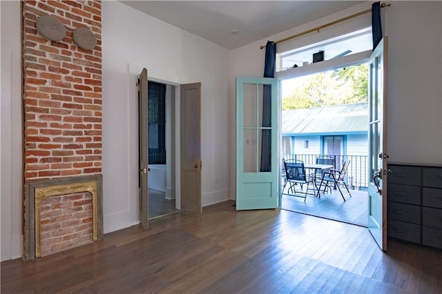 623-25 Louisa St, New Orleans, LA 70117 - spare room with wood finished floors and baseboards