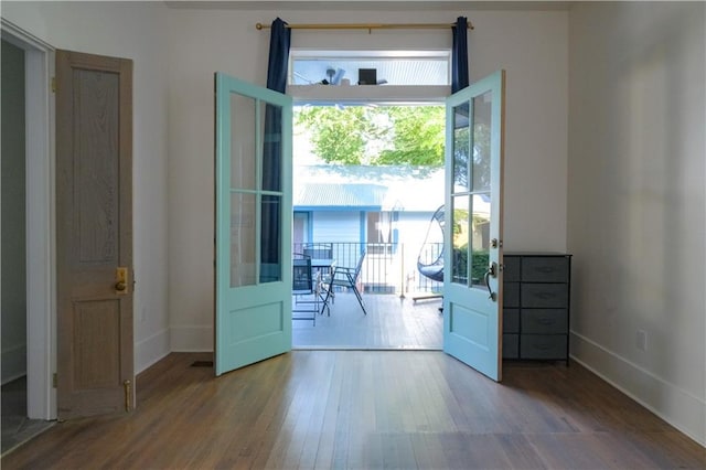 623-25 Louisa St, New Orleans, LA 70117 - unfurnished room with wood finished floors and baseboards