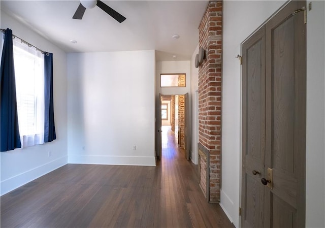 623-25 Louisa St, New Orleans, LA 70117 - spare room featuring a ceiling fan and dark wood finished floors