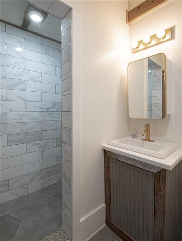 623-25 Louisa St, New Orleans, LA 70117 - full bathroom featuring vanity and a tile shower