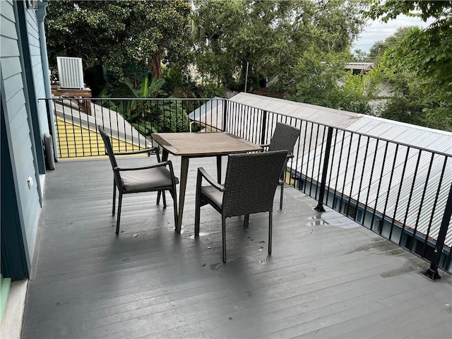 623-25 Louisa St, New Orleans, LA 70117 - wooden deck with outdoor dining area