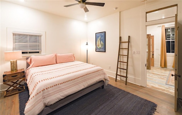 623-25 Louisa St, New Orleans, LA 70117 - bedroom featuring wood finished floors and a ceiling fan