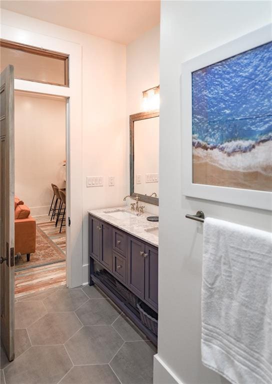 623-25 Louisa St, New Orleans, LA 70117 - bathroom featuring double vanity and tile patterned floors