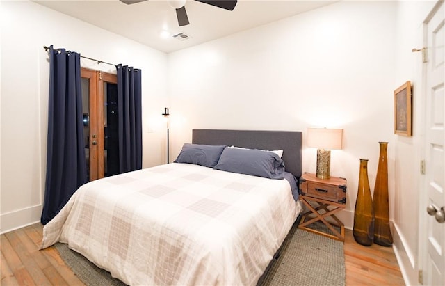 623-25 Louisa St, New Orleans, LA 70117 - bedroom with light wood-style flooring and ceiling fan