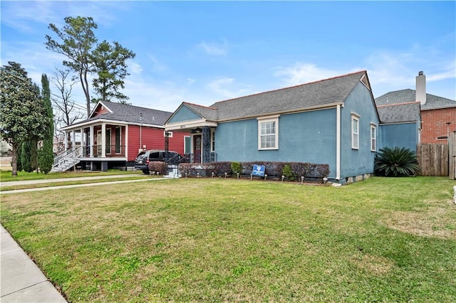603 E Manley Ave, Metairie, LA 70001 - view of front facade with covered porch, stucco siding, and a shingled roof