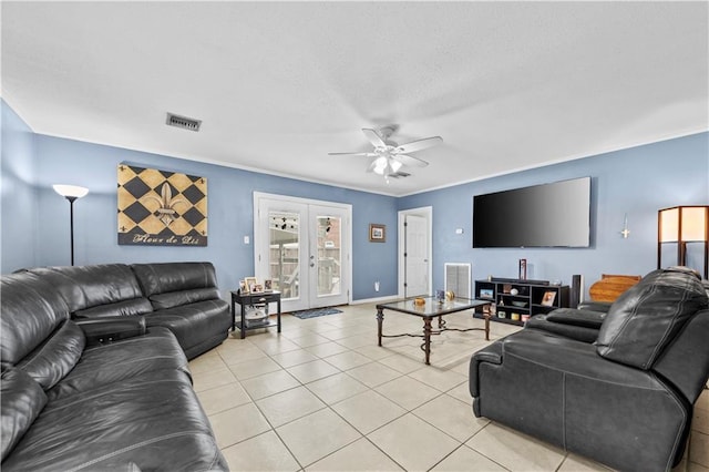603 E Manley Ave, Metairie, LA 70001 - living room with ceiling fan, light tile patterned floors, french doors, crown molding, and a textured ceiling