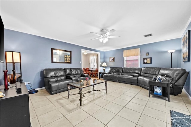 603 E Manley Ave, Metairie, LA 70001 - living area featuring a ceiling fan, light tile patterned flooring, and ornamental molding