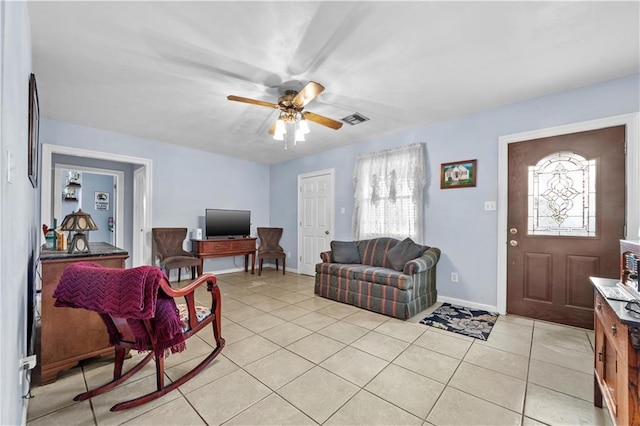 603 E Manley Ave, Metairie, LA 70001 - living room featuring light tile patterned floors, ceiling fan, and healthy amount of natural light