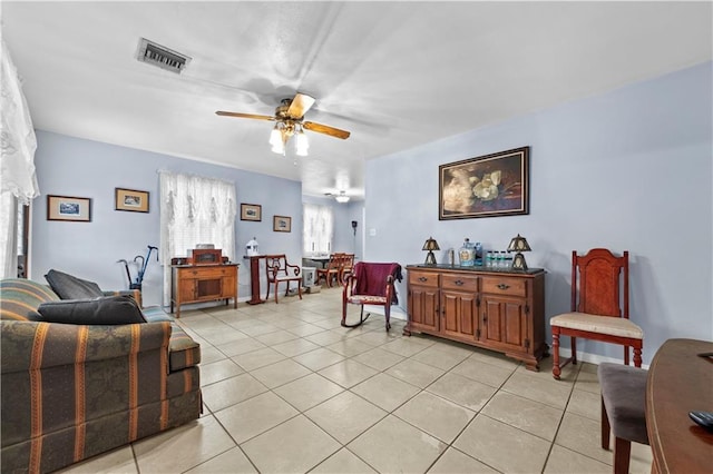 603 E Manley Ave, Metairie, LA 70001 - living area with light tile patterned floors and ceiling fan