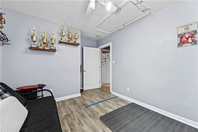 603 E Manley Ave, Metairie, LA 70001 - living area featuring attic access, wood finished floors, and a ceiling fan