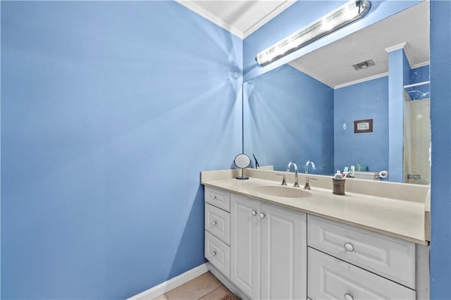 603 E Manley Ave, Metairie, LA 70001 - bathroom featuring crown molding, vanity, and tile patterned flooring