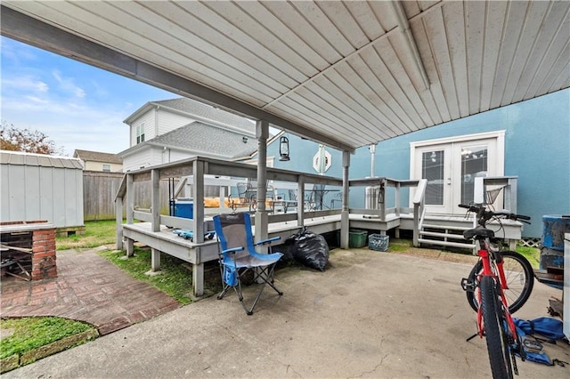 603 E Manley Ave, Metairie, LA 70001 - view of patio featuring a deck, french doors, and a storage unit