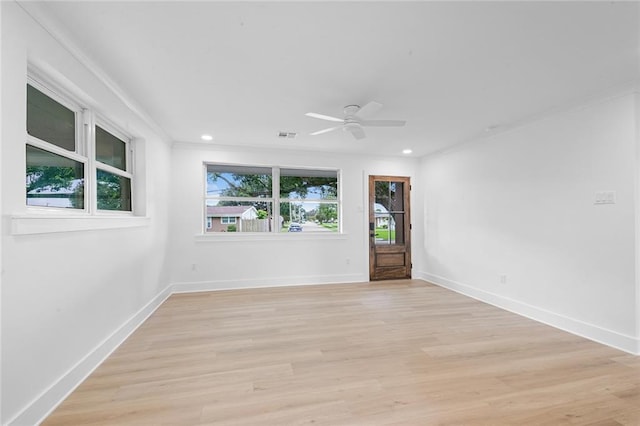 8853 26th St, Metairie, LA 70003 - spare room featuring crown molding, a ceiling fan, light wood-style flooring, and recessed lighting