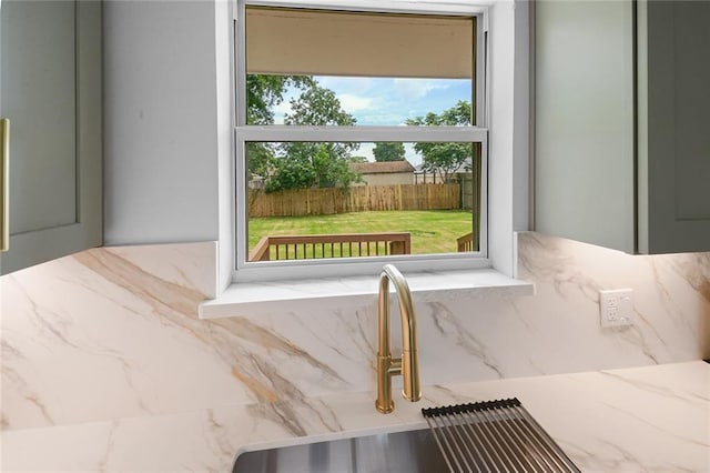 8853 26th St, Metairie, LA 70003 - kitchen view of a sink and light stone counters