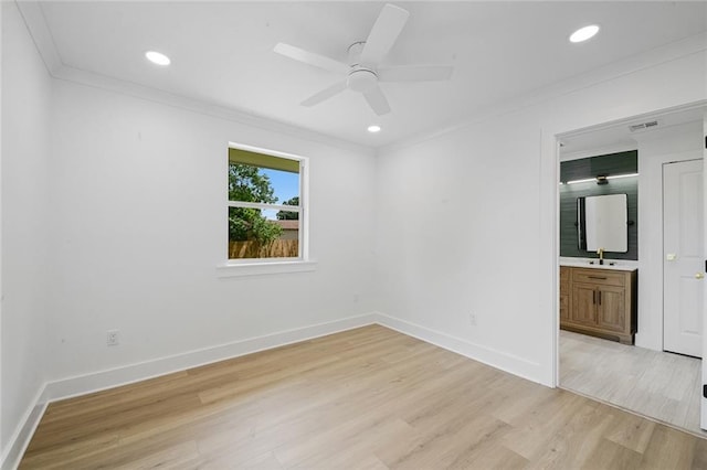 8853 26th St, Metairie, LA 70003 - unfurnished bedroom featuring ornamental molding, light wood-style floors, ensuite bathroom, recessed lighting, and a ceiling fan