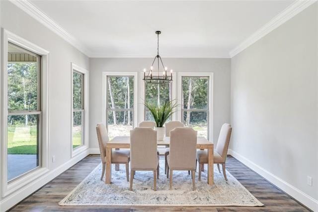 5053 Twin River Pl, Covington, LA 70433 - dining space featuring a chandelier, healthy amount of natural light, dark wood-type flooring, and ornamental molding