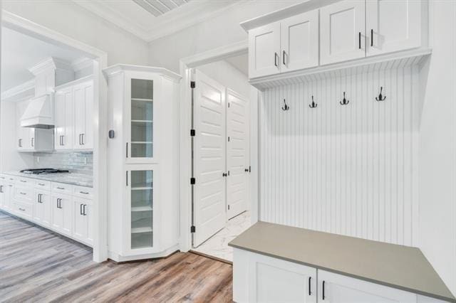 5053 Twin River Pl, Covington, LA 70433 - mudroom with light wood-style flooring and ornamental molding