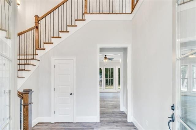 5053 Twin River Pl, Covington, LA 70433 - foyer with wood finished floors, a ceiling fan, and stairway