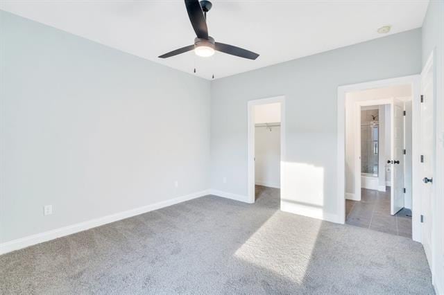 5053 Twin River Pl, Covington, LA 70433 - unfurnished bedroom with carpet floors, a spacious closet, and a ceiling fan
