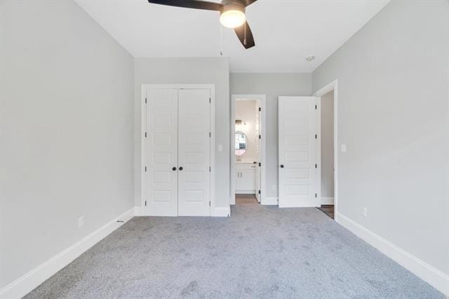5053 Twin River Pl, Covington, LA 70433 - unfurnished bedroom with carpet, a closet, and a ceiling fan