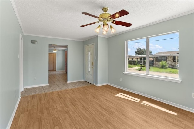 1403 W First St, Belle Chasse, LA 70037 - unfurnished room featuring ceiling fan, a textured ceiling, wood finished floors, and crown molding