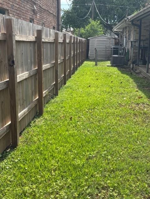 305 Lilac St, Metairie, LA 70005 - fenced backyard featuring a storage shed