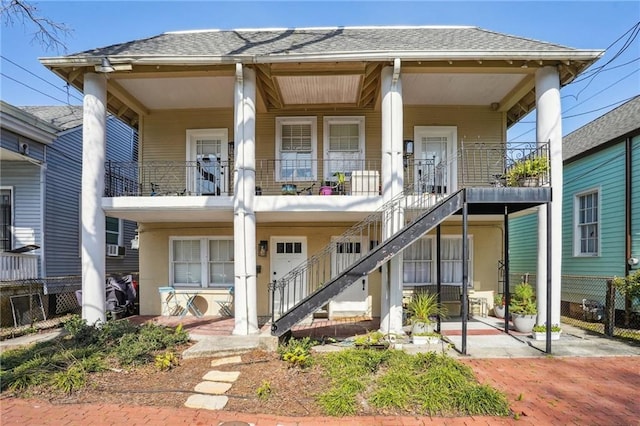 618-24 Fern St, New Orleans, LA 70118 - view of front facade featuring a porch, stairs, and roof with shingles