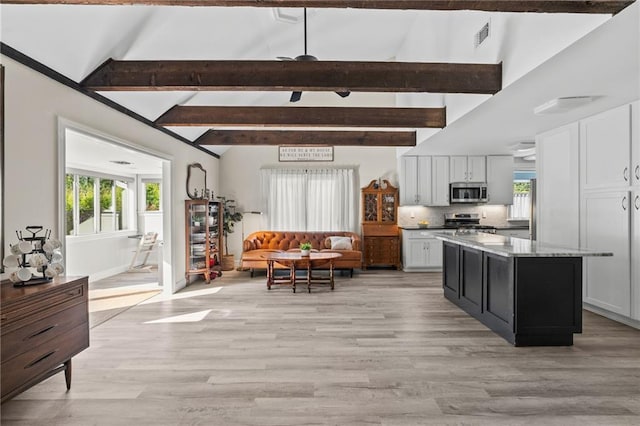 59246 Cypress Bayou Ln, Lacombe, LA 70445 - kitchen with stainless steel appliances, open floor plan, healthy amount of natural light, and light wood-type flooring