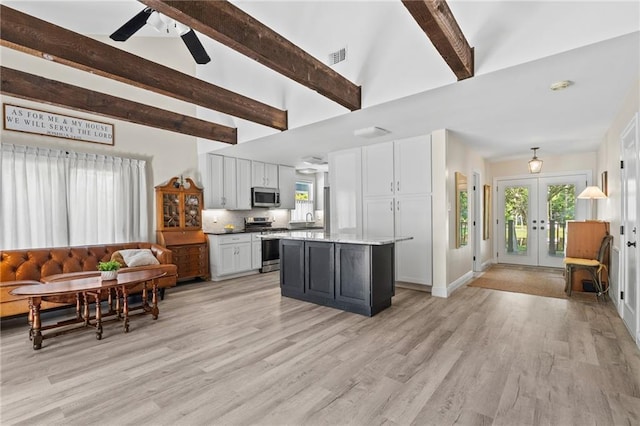 59246 Cypress Bayou Ln, Lacombe, LA 70445 - kitchen featuring stainless steel appliances, french doors, beamed ceiling, white cabinets, and ceiling fan
