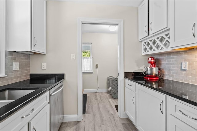 59246 Cypress Bayou Ln, Lacombe, LA 70445 - kitchen with dishwasher, backsplash, light wood-style floors, and white cabinets