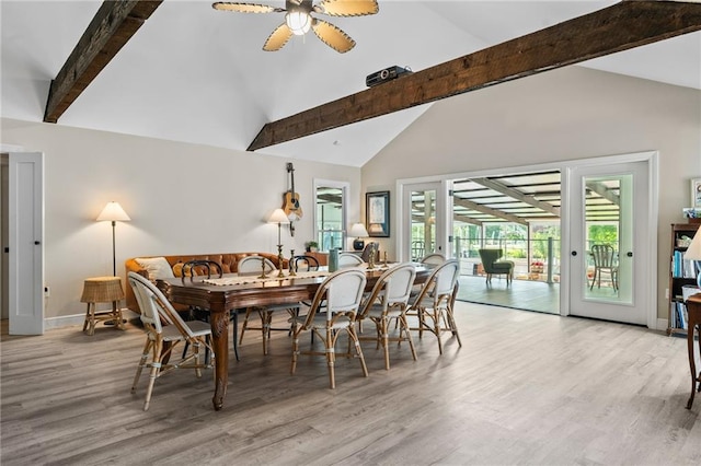 59246 Cypress Bayou Ln, Lacombe, LA 70445 - dining area with beamed ceiling, wood finished floors, a ceiling fan, and high vaulted ceiling