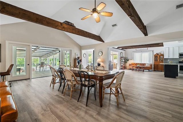 59246 Cypress Bayou Ln, Lacombe, LA 70445 - dining space featuring high vaulted ceiling, beamed ceiling, light wood-style floors, plenty of natural light, and a ceiling fan