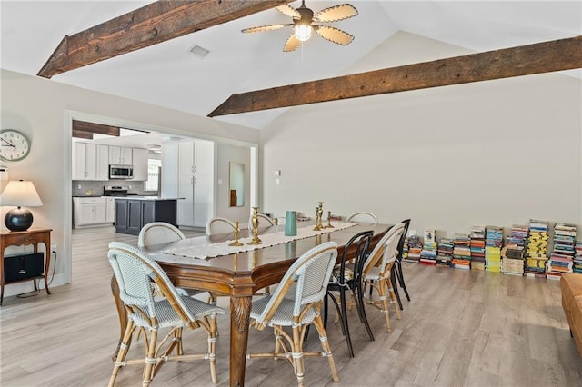 59246 Cypress Bayou Ln, Lacombe, LA 70445 - dining room with high vaulted ceiling, a ceiling fan, light wood-style flooring, and beam ceiling