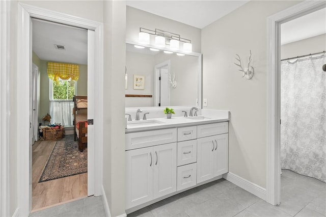 59246 Cypress Bayou Ln, Lacombe, LA 70445 - bathroom with double vanity and tile patterned floors