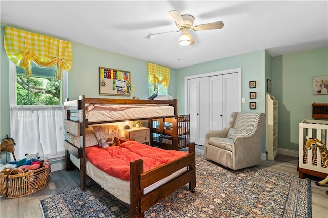 59246 Cypress Bayou Ln, Lacombe, LA 70445 - bedroom featuring wood finished floors, a closet, and a ceiling fan