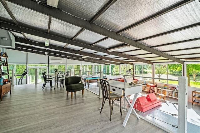 59246 Cypress Bayou Ln, Lacombe, LA 70445 - sunroom featuring a wall mounted AC and wood finished floors