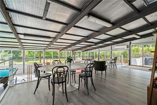 59246 Cypress Bayou Ln, Lacombe, LA 70445 - sunroom / solarium featuring a wall unit AC and lofted ceiling