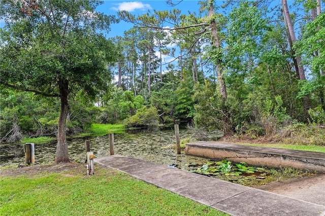 59246 Cypress Bayou Ln, Lacombe, LA 70445 - view of yard with a boat dock and a water view