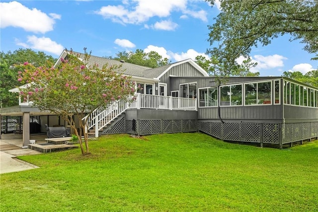 59246 Cypress Bayou Ln, Lacombe, LA 70445 - rear view of house with a sunroom, a yard, a patio, stairs, and a deck