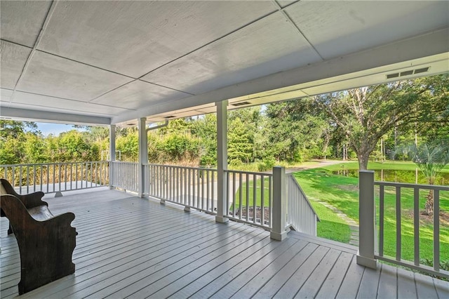 59246 Cypress Bayou Ln, Lacombe, LA 70445 - wooden deck featuring a yard and view of scattered trees