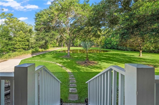 59246 Cypress Bayou Ln, Lacombe, LA 70445 - view of green lawn featuring view of scattered trees