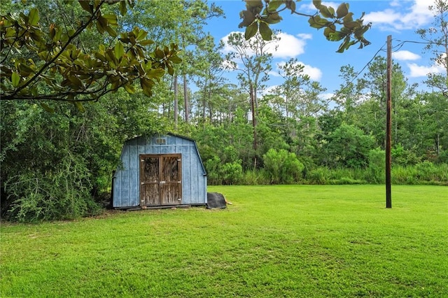 59246 Cypress Bayou Ln, Lacombe, LA 70445 - view of green lawn featuring a storage shed