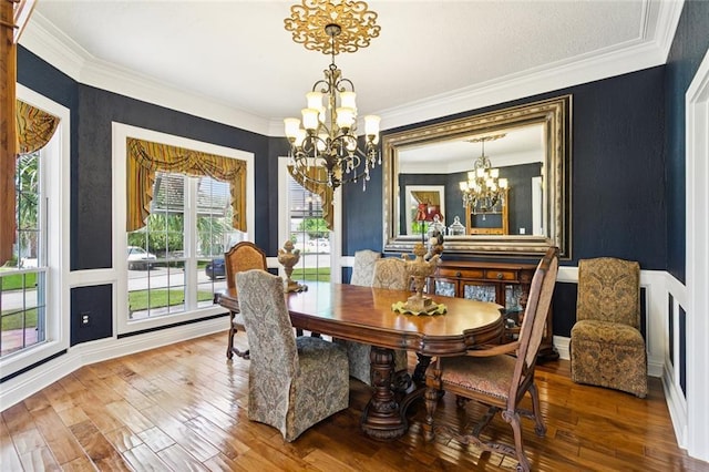 8 Oak Tree Dr, Slidell, LA 70458 - dining area with a chandelier, hardwood / wood-style floors, and crown molding