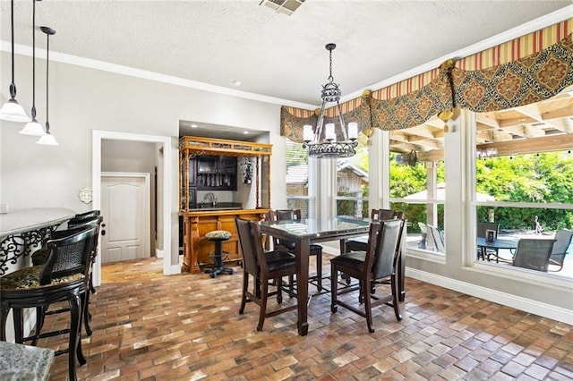 8 Oak Tree Dr, Slidell, LA 70458 - dining room with brick flooring, ornamental molding, a textured ceiling, and healthy amount of natural light