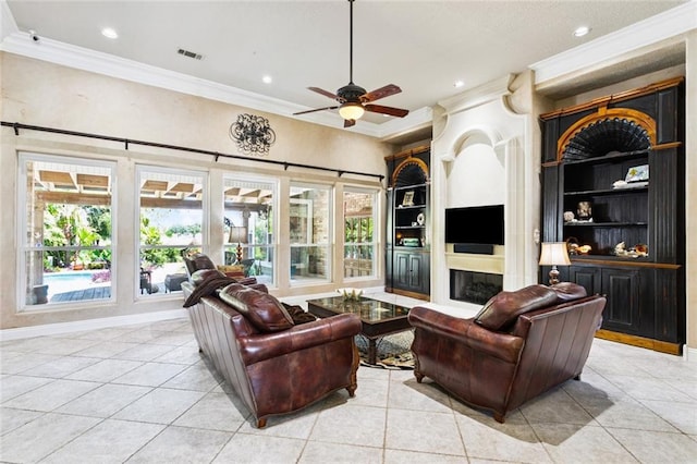 8 Oak Tree Dr, Slidell, LA 70458 - living room with ornamental molding, light tile patterned floors, a ceiling fan, healthy amount of natural light, and built in shelves