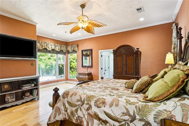 8 Oak Tree Dr, Slidell, LA 70458 - bedroom featuring a textured ceiling, wood finished floors, crown molding, recessed lighting, and ceiling fan