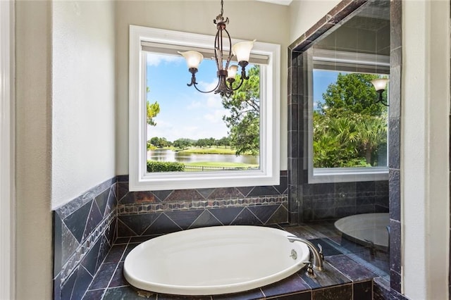 8 Oak Tree Dr, Slidell, LA 70458 - full bathroom featuring a bath, a chandelier, and a water view