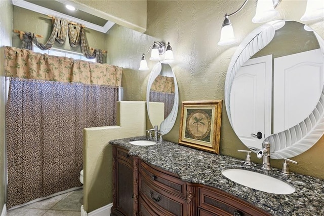 8 Oak Tree Dr, Slidell, LA 70458 - full bathroom featuring double vanity, tile patterned flooring, a textured wall, ornamental molding, and a shower with curtain