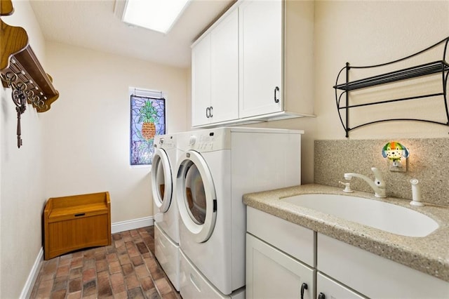 8 Oak Tree Dr, Slidell, LA 70458 - laundry room featuring washing machine and clothes dryer, brick flooring, and cabinet space